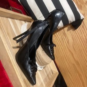 Black heels, ribbon accents.